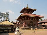 Kathmandu Changu Narayan 01 Chinnamasta Temple And Changu Narayan Temple East Entrance Changu Narayan Temple is a pagoda-style Hindu temple dedicated to Vishnu in his incarnation as Narayan. It was originally built around the 4C, but the present temple was rebuilt in 1702 after it was destroyed by fire. It is situated on a ridge at 1541m overlooking the Kathmandu Valley, about 22 km to the east of Kathmandu and 6 km north of Bhaktapur. Though the temple is quite beautiful, especially the doors and front facade, Changu Narayan is not known for its temple but for the stone statues, bas-relief carvings, and inscriptions that are scattered around the temple courtyard, created between the 5th and 13th century. On the left is the Chinnamasta Temple and at the bottom just to the left of centre is a Ganesh shrine.